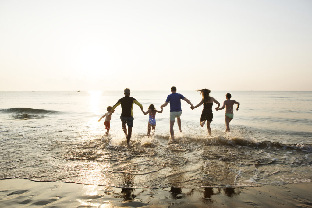 Family playing at the beach