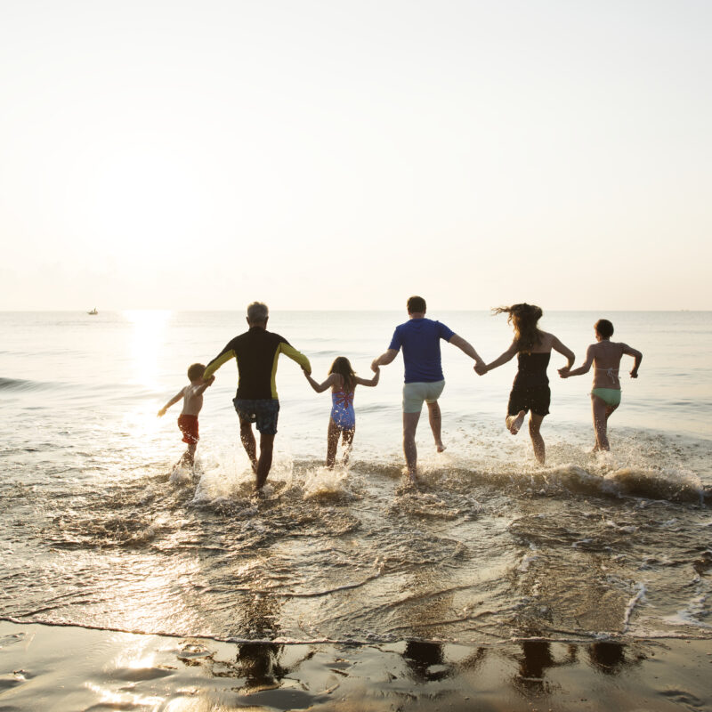 Family playing at the beach